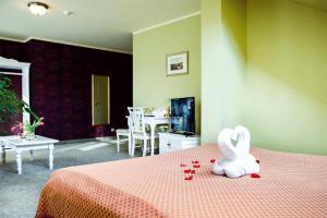 Postel nebo postele na pokoji v ubytování Hotel Metsis