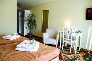 Postel nebo postele na pokoji v ubytování Hotel Metsis