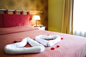 Postel nebo postele na pokoji v ubytování Hotel Metsis