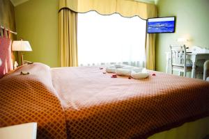 Postel nebo postele na pokoji v ubytování Hotel Metsis