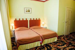 Postel nebo postele na pokoji v ubytování Hotel Metsis