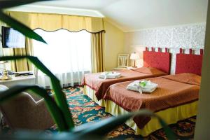 Tempat tidur dalam kamar di Hotel Metsis