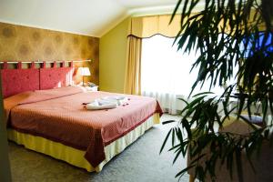 Postel nebo postele na pokoji v ubytování Hotel Metsis
