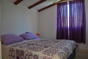 Cama o camas de una habitación en Apartments Lastavica