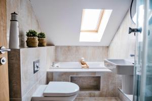 a bathroom with a toilet and a sink at Finest Retreats - Tolcarne Stay - Luxury Newquay Apartment in Newquay