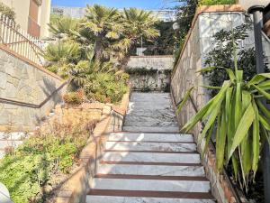 a set of stairs leading up to a building at B&B Sanremo dely' house in Sanremo