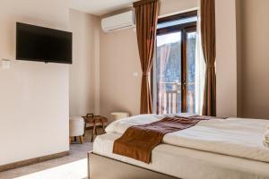 Postel nebo postele na pokoji v ubytování Family Hotel LILIUM