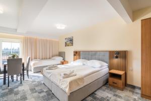 Posteľ alebo postele v izbe v ubytovaní Hotel Perła Dunajca
