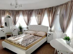 Postel nebo postele na pokoji v ubytování Penzion a Restaurace Belveder