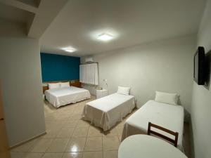 Postel nebo postele na pokoji v ubytování Ônix Hotel
