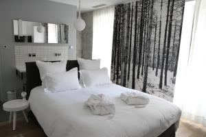 Letto o letti in una camera di Hôtel Quatorze