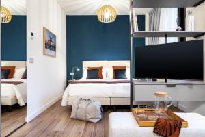 Llit o llits en una habitació de CO99 Art Building Residence