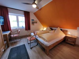 Postel nebo postele na pokoji v ubytování Naturwert Hotel Garni Ursula