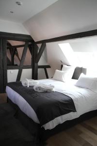 Letto o letti in una camera di Hôtel Quatorze
