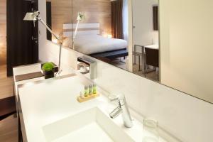 Postel nebo postele na pokoji v ubytování Hotel Le Colombier Suites