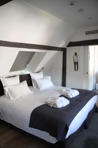 Letto o letti in una camera di Hôtel Quatorze
