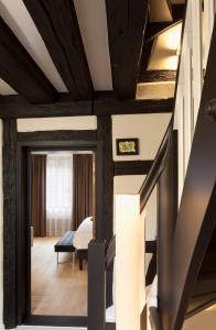 Postel nebo postele na pokoji v ubytování Hotel Le Colombier Suites