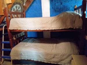 Ein Etagenbett oder Etagenbetten in einem Zimmer der Unterkunft La Casa del Naufrago