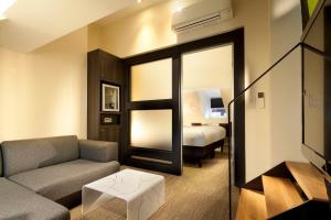 Postel nebo postele na pokoji v ubytování Hotel Le Colombier Suites
