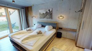 A bed or beds in a room at Appartement Hauser