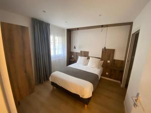 Säng eller sängar i ett rum på Hotel Restaurant Noblia