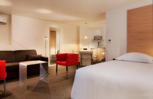 Postel nebo postele na pokoji v ubytování Hotel Le Pavillon 7