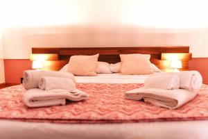 Tempat tidur dalam kamar di De Lamartine a Marina di Corricella