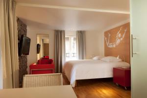 Postel nebo postele na pokoji v ubytování Hotel Le Pavillon 7