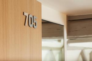 Postel nebo postele na pokoji v ubytování Hotel Le Pavillon 7