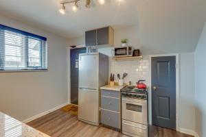 a kitchen with a refrigerator and a stove at Nashville Flat Close to Downtown 101 in Nashville