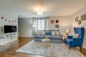 a living room with a blue couch and two blue chairs at Nashville Flat Close to Downtown 101 in Nashville