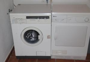 a white washer and dryer in a room at Villa Las Dalias in Almuñécar
