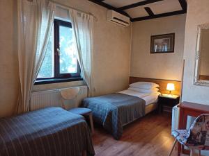 Postel nebo postele na pokoji v ubytování Avalon Rooms
