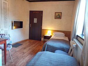 Postel nebo postele na pokoji v ubytování Avalon Rooms