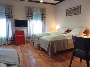 Postel nebo postele na pokoji v ubytování Avalon Rooms