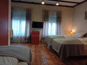 Postel nebo postele na pokoji v ubytování Avalon Rooms