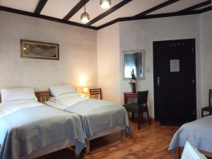 Postel nebo postele na pokoji v ubytování Avalon Rooms