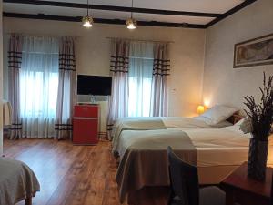 Postel nebo postele na pokoji v ubytování Avalon Rooms