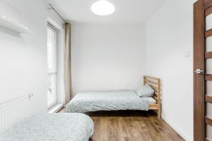 Posteľ alebo postele v izbe v ubytovaní Chill Apartments Fieldorfa