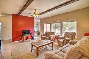 a living room with couches and a tv at Borrego Springs Stargazing Home with Mtn Views in Borrego Springs