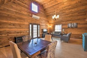 a dining room with a table and a living room at Woodsy Blue Ridge Retreat, 3 Mi to Downtown! in Blue Ridge