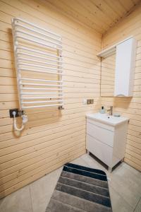 a bathroom with a sink and a window at Space Place in Yablunytsya