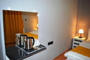 a kitchen with a stove and a coffee maker at Hostel Terra Vista in Goreme