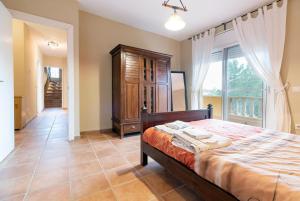 Posteľ alebo postele v izbe v ubytovaní Casa Xixella a 15 min de Sitges + 34 fotografií