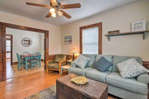a living room with a couch and a table at Galveston ‘Blue Bungalow’ - Walk to Beach! in Galveston