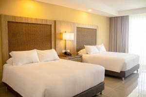 Ένα ή περισσότερα κρεβάτια σε δωμάτιο στο Hotel Campestre las Camelias