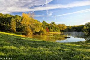 a view of a river with a boat on it at DOMAINE DE LA PORTE in Agonac
