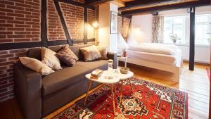 Ein Bett oder Betten in einem Zimmer der Unterkunft Appartementhotel Blomberger Hof