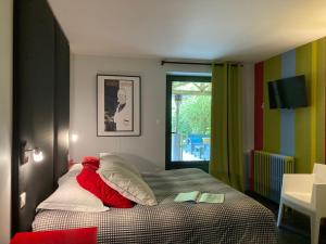 Postel nebo postele na pokoji v ubytování La Villa des Forges