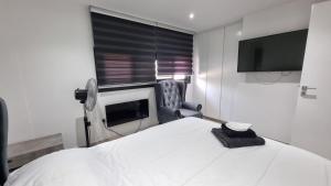 Ένα ή περισσότερα κρεβάτια σε δωμάτιο στο Nagia’s Apartment